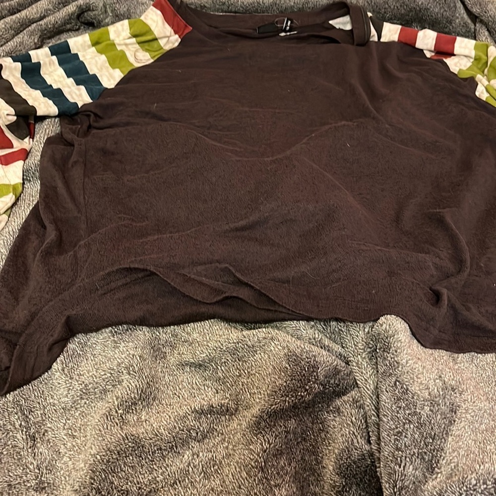 A charcoal gray shirt with white burgundy blue and green sleeves never worn.